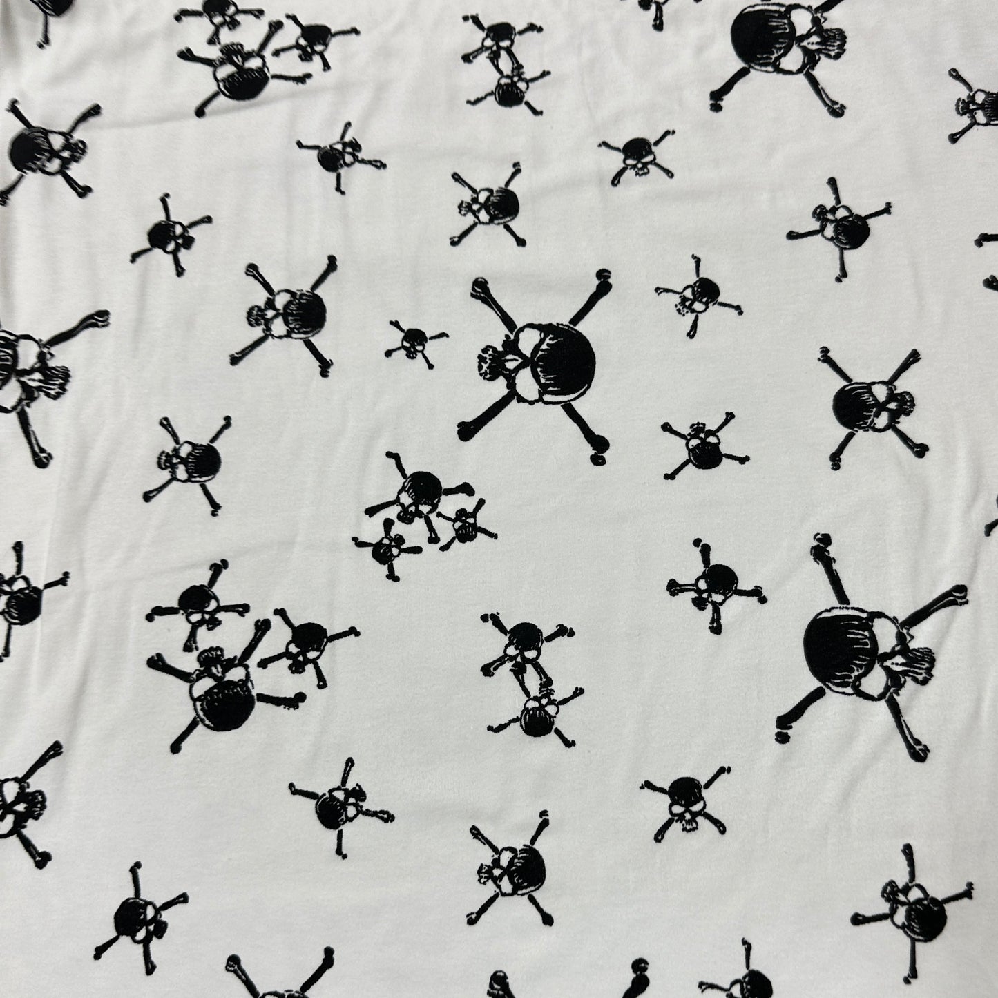 Black Skulls on White Cotton Interlock Fabric