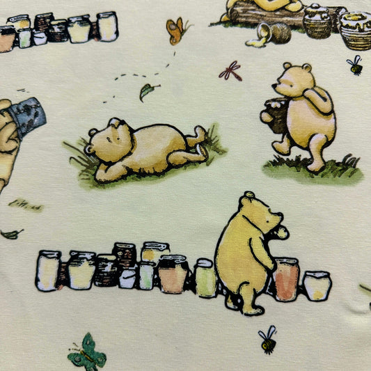 Winnie the Pooh and Friends on Yellow Organic Cotton/Spandex Jersey Fabric