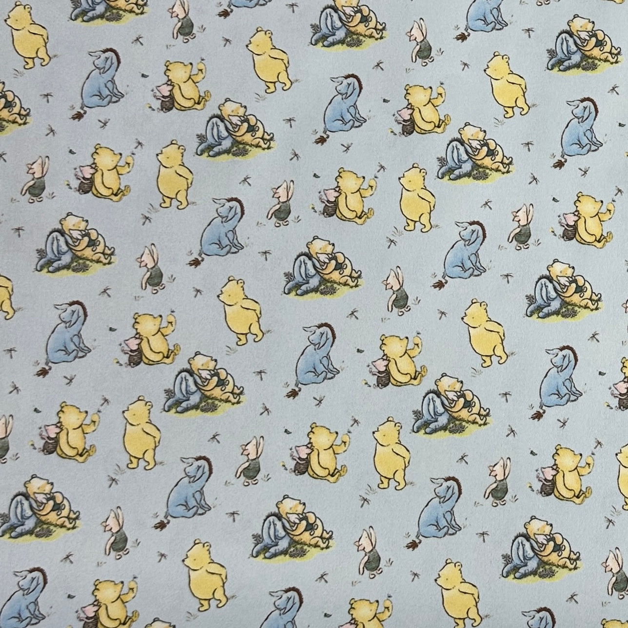 Winnie the Pooh and Friends on Blue 1 mil PUL Fabric - Made in the USA