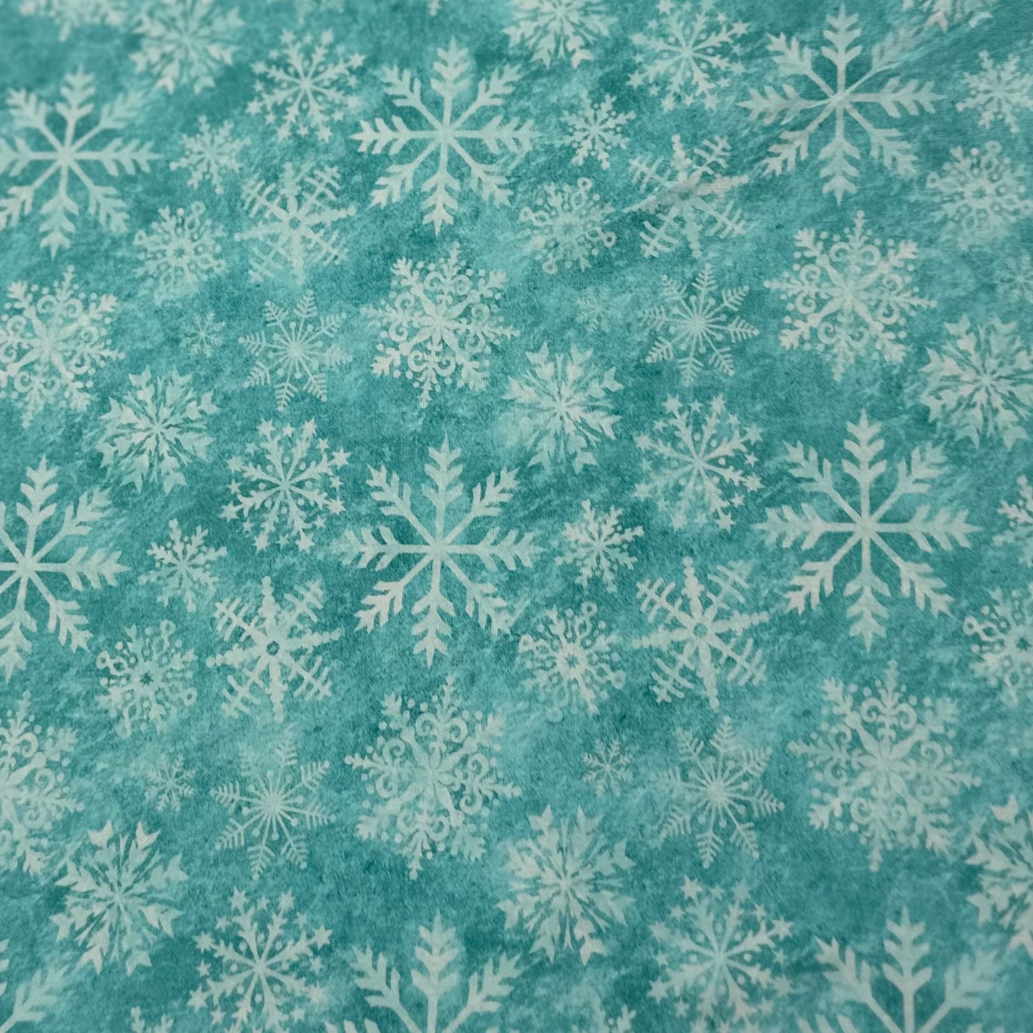 White Snowflakes on Aqua Organic Cotton/Spandex Jersey Fabric