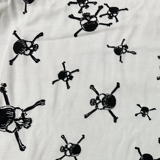 Black Skulls on White Cotton Interlock Fabric