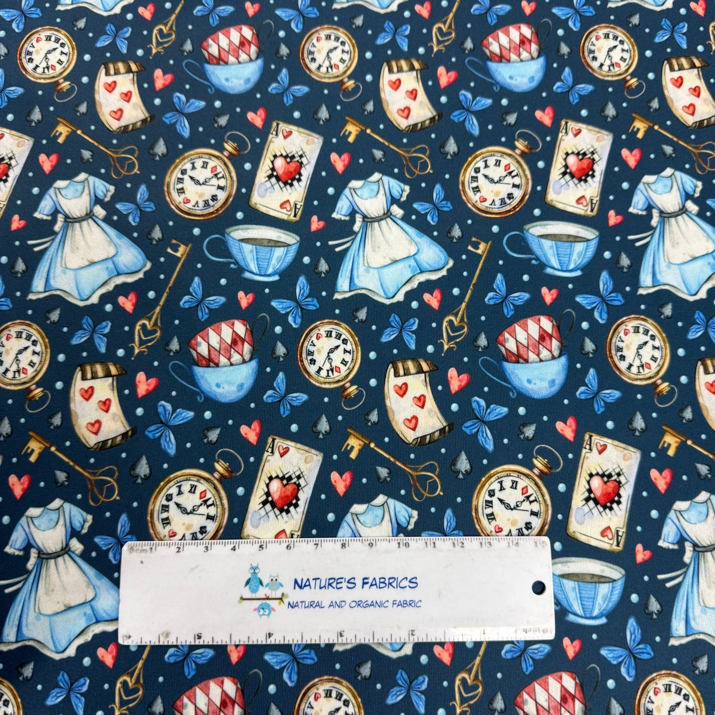 Alice in Wonderland on Blue 1 mil PUL Fabric - Made in the USA