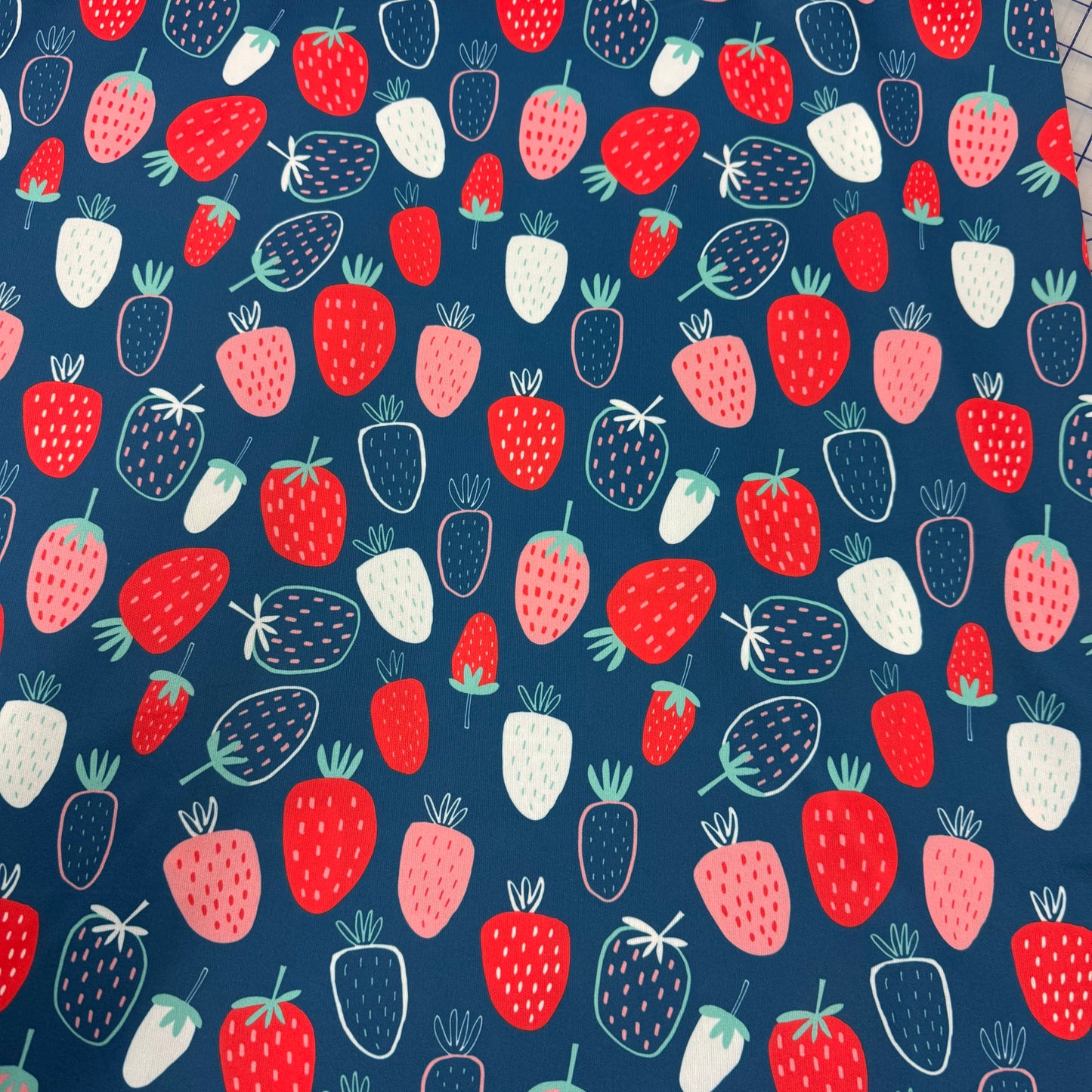 Summer Strawberries on Navy 1 mil PUL Fabric - Made in the USA