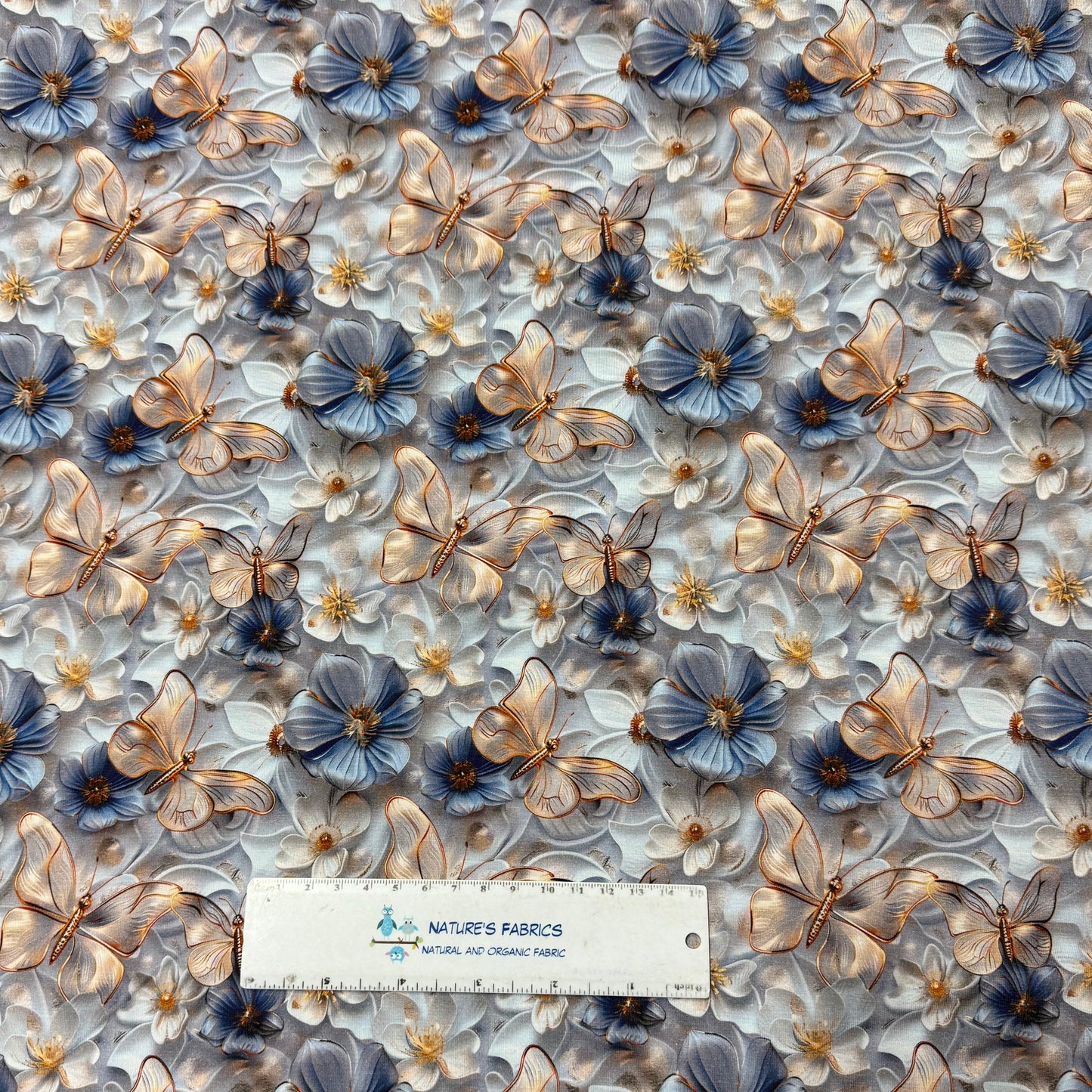 Gold Butterflies on Light Blue Organic Cotton/Spandex Jersey Fabric