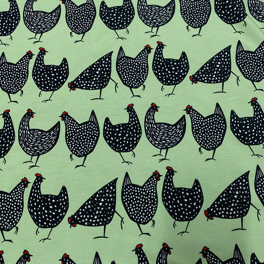 Black Chickens on Green Organic Cotton/Spandex Jersey Fabric