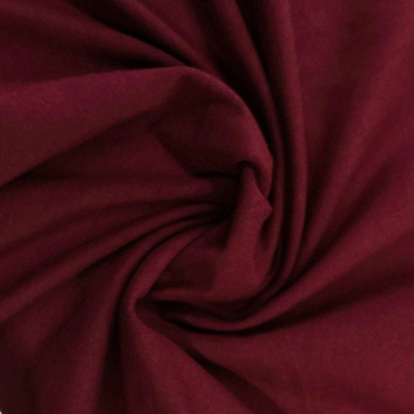 Burgundy cotton spandex jersey fabric with soft drape and slight stretch, close-up view