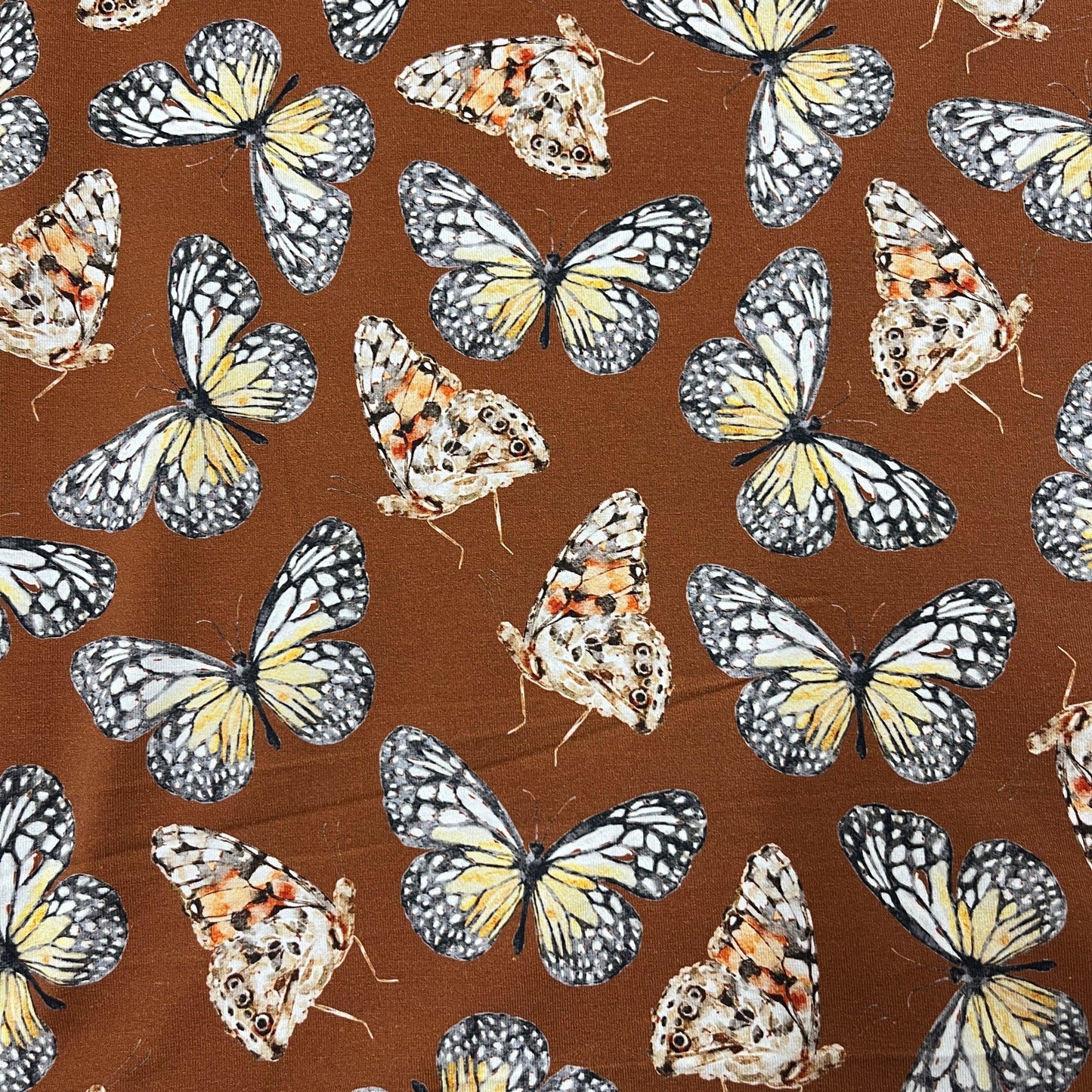 Butterflies on Rust Bamboo/Spandex Jersey Fabric - Nature's Fabrics