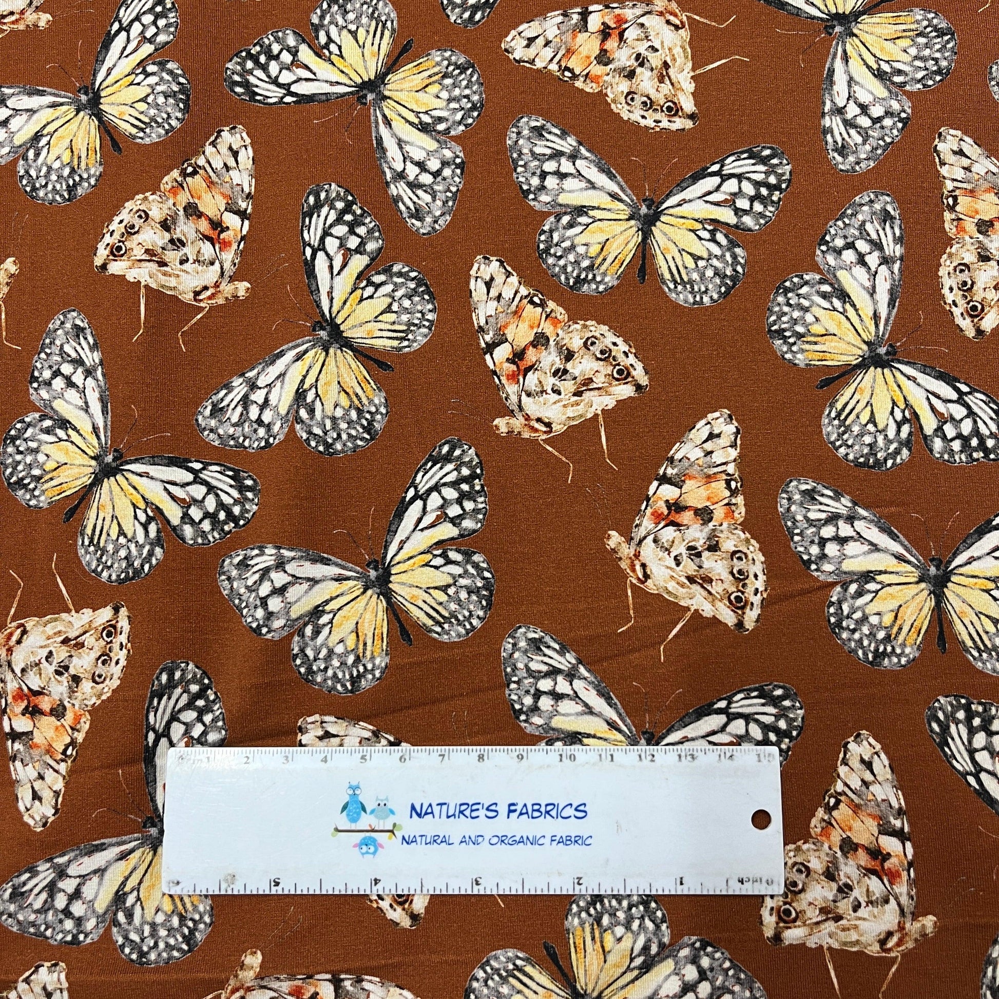Butterflies on Rust Bamboo/Spandex Jersey Fabric - Nature's Fabrics