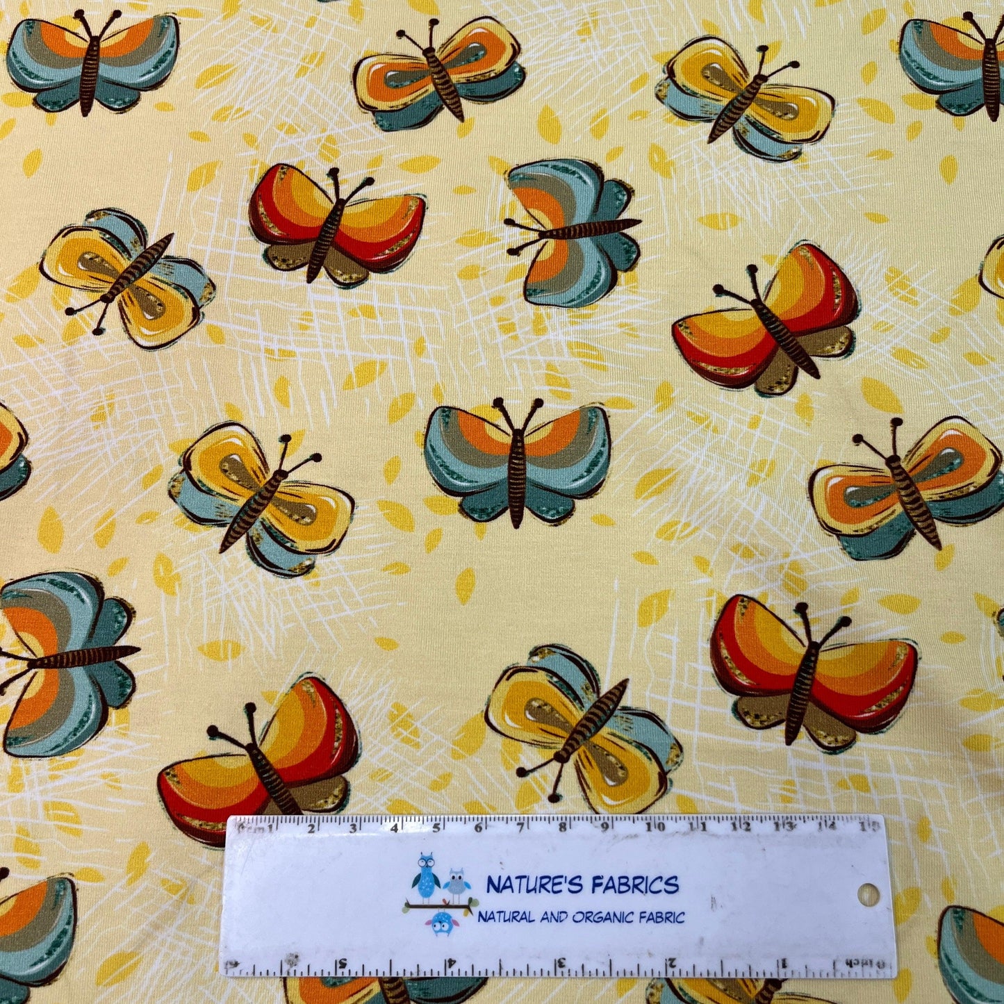 Butterflies on Yellow Bamboo/Spandex Jersey Fabric - Nature's Fabrics