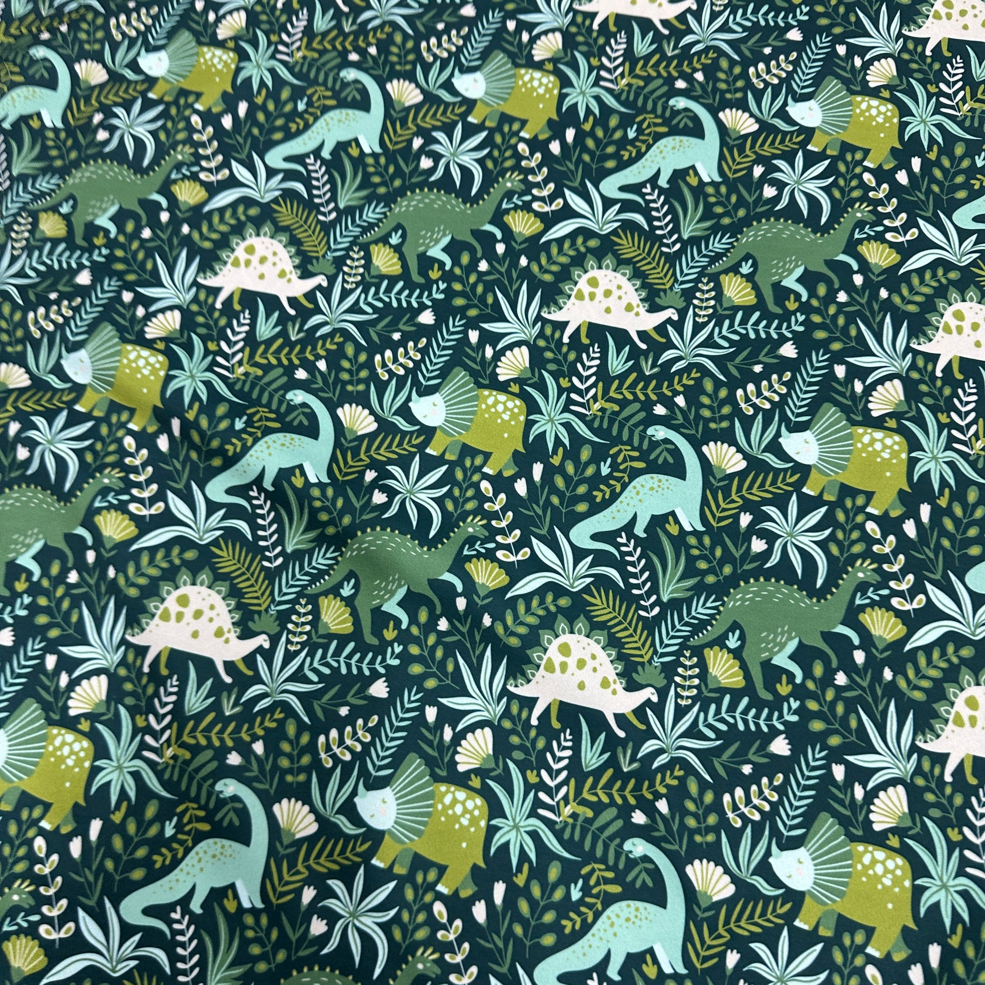Dinosaurs on Green 1 mil PUL Fabric - Made in the USA - Nature's Fabrics