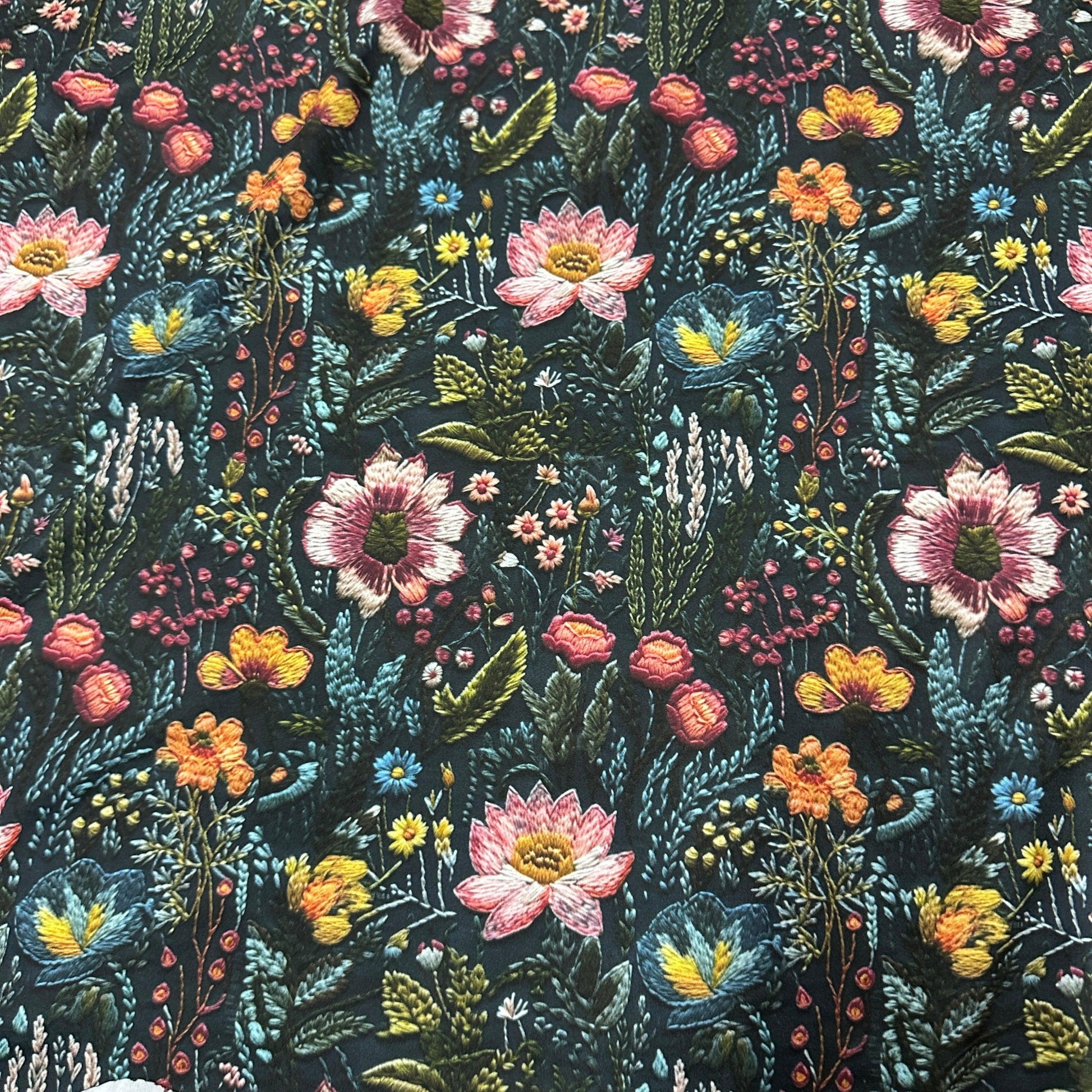 Embroidered Flower Garden on Polyester/Spandex Jersey Fabric - Nature's Fabrics