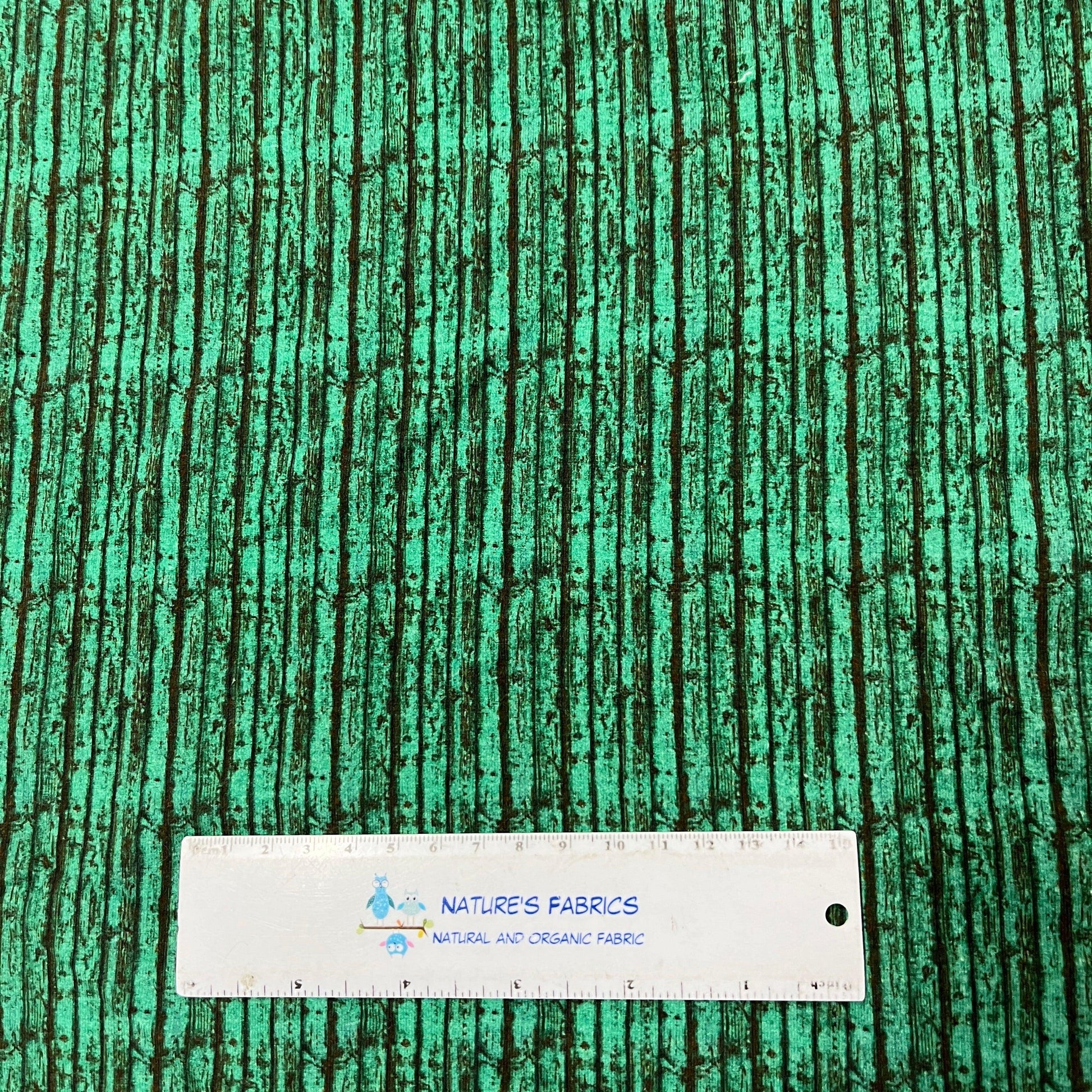 Green Boards on White Cotton/Spandex Jersey Fabric - Nature's Fabrics