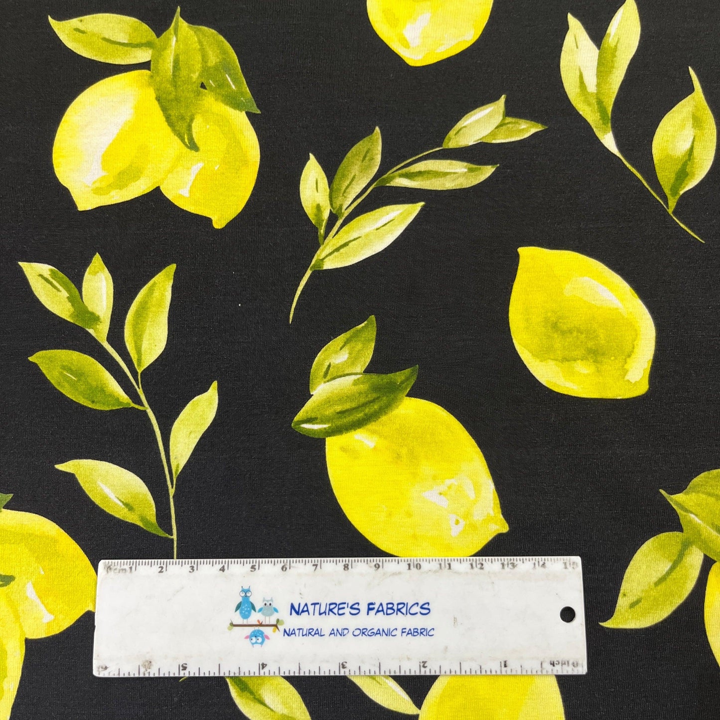 Lemons on Black Bamboo/Spandex Jersey Fabric - Nature's Fabrics