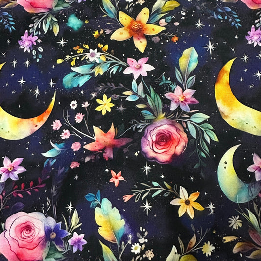 Nature's Fabrics celestial print fabric with colorful flowers and crescent moons on a dark background