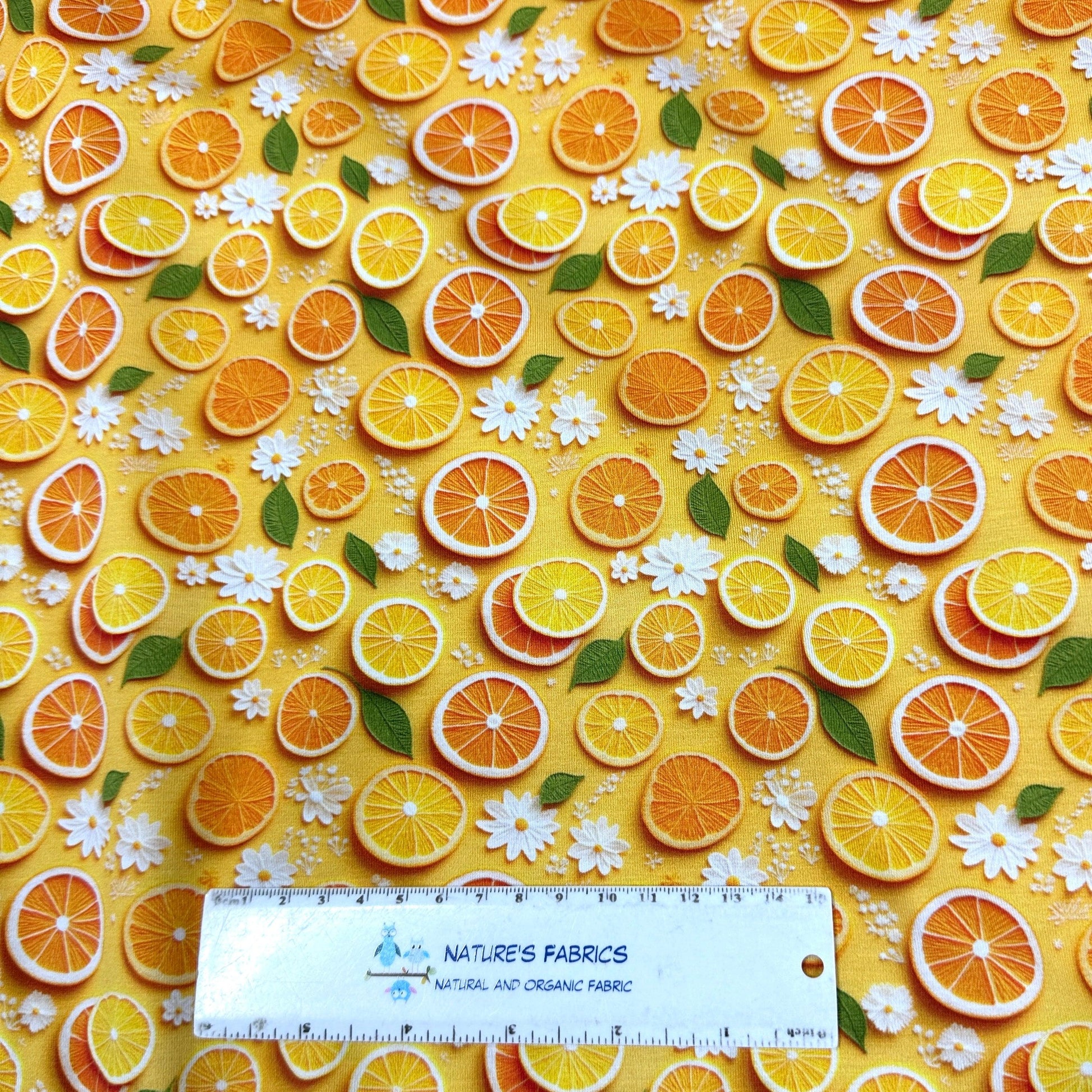 Orange Slices and Daisies on Bamboo/Spandex Jersey Fabric - Nature's Fabrics