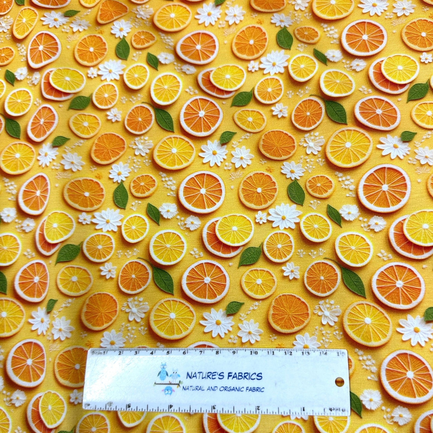 Orange Slices and Daisies on Bamboo/Spandex Jersey Fabric - Nature's Fabrics