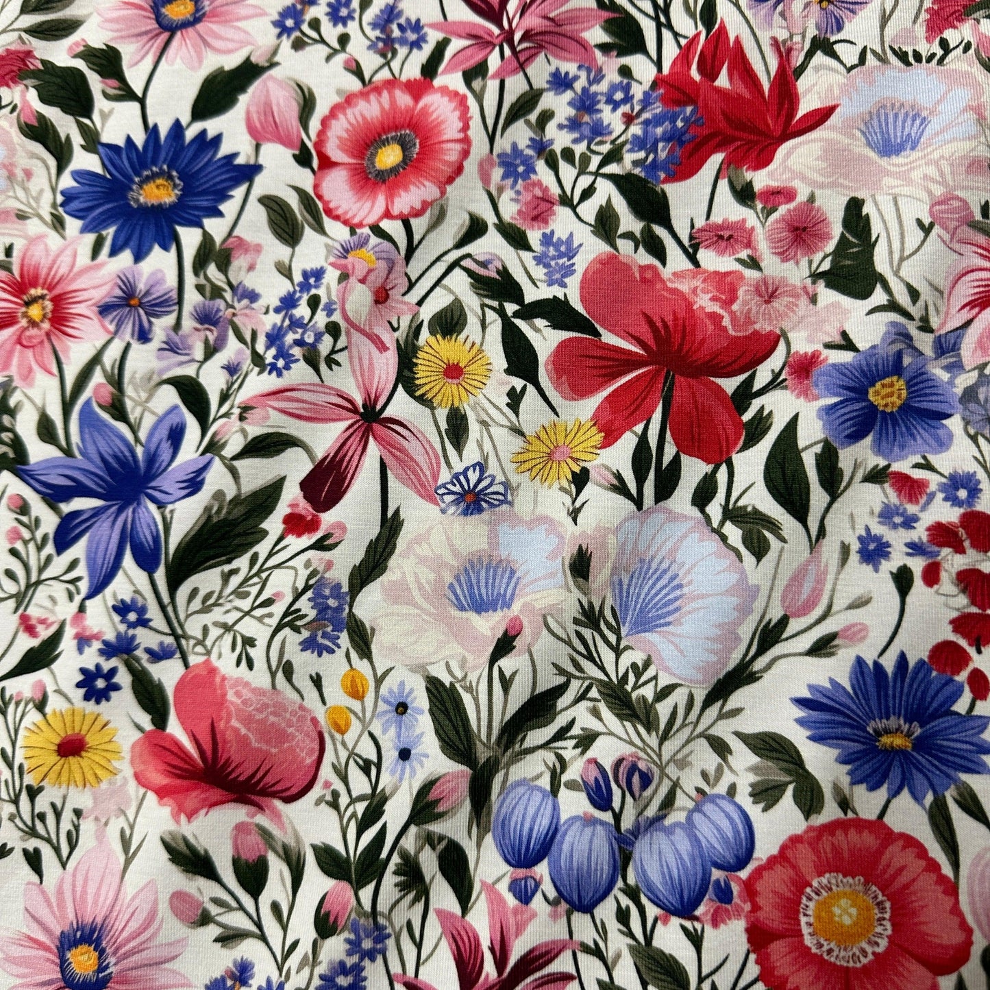 Pink and Blue Flowers on Ivory Organic Cotton/Spandex Jersey Fabric - Nature's Fabrics