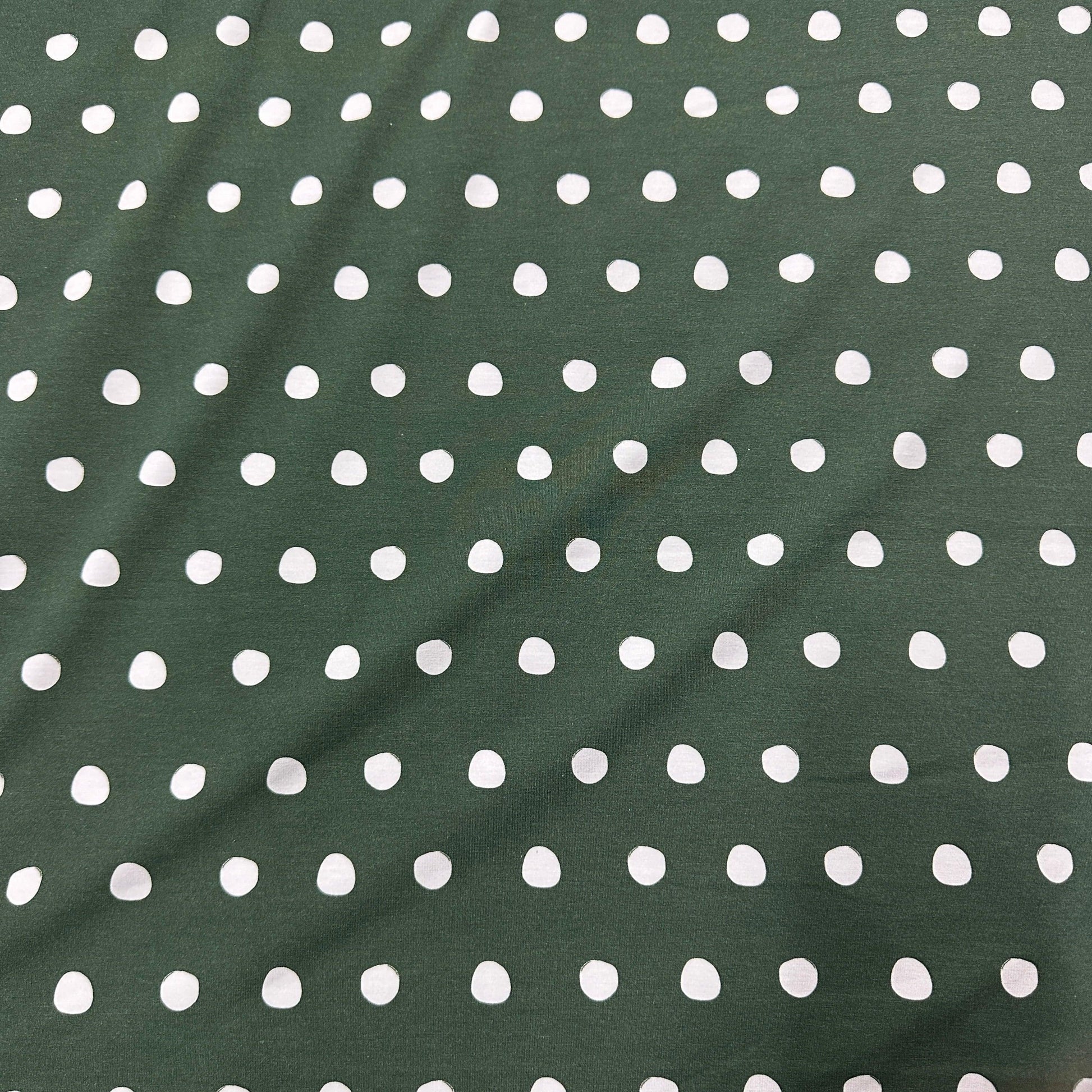 White Polka Dots on Green Bamboo/Spandex Jersey Fabric - Nature's Fabrics