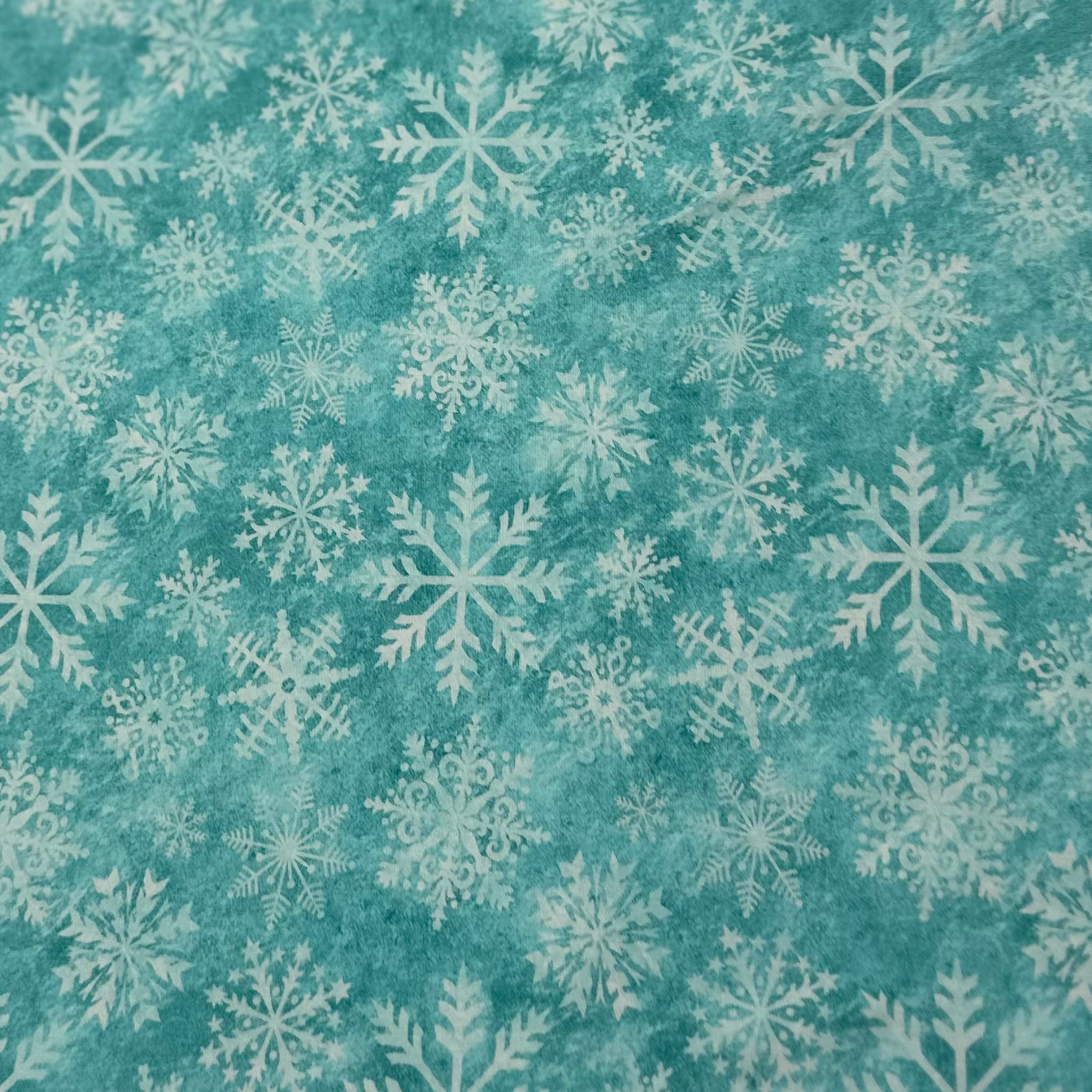White Snowflakes on Aqua Organic Cotton/Spandex Jersey Fabric - Nature's Fabrics