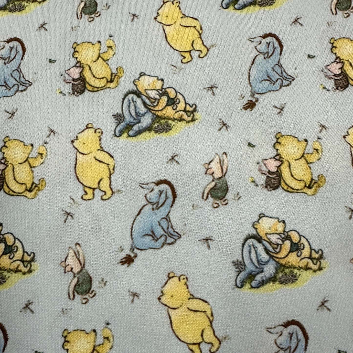 Winnie the Pooh and Friends on Blue 1 mil PUL Fabric - Made in the USA - Nature's Fabrics