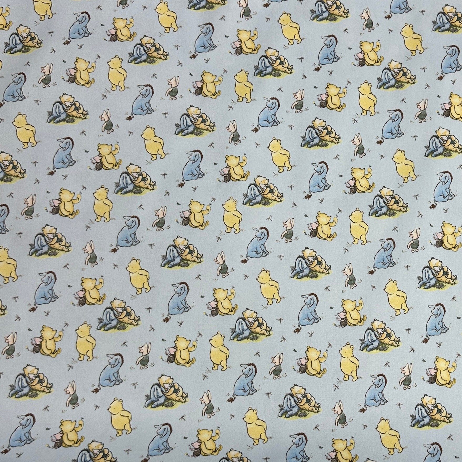 Winnie the Pooh and Friends on Blue 1 mil PUL Fabric - Made in the USA - Nature's Fabrics