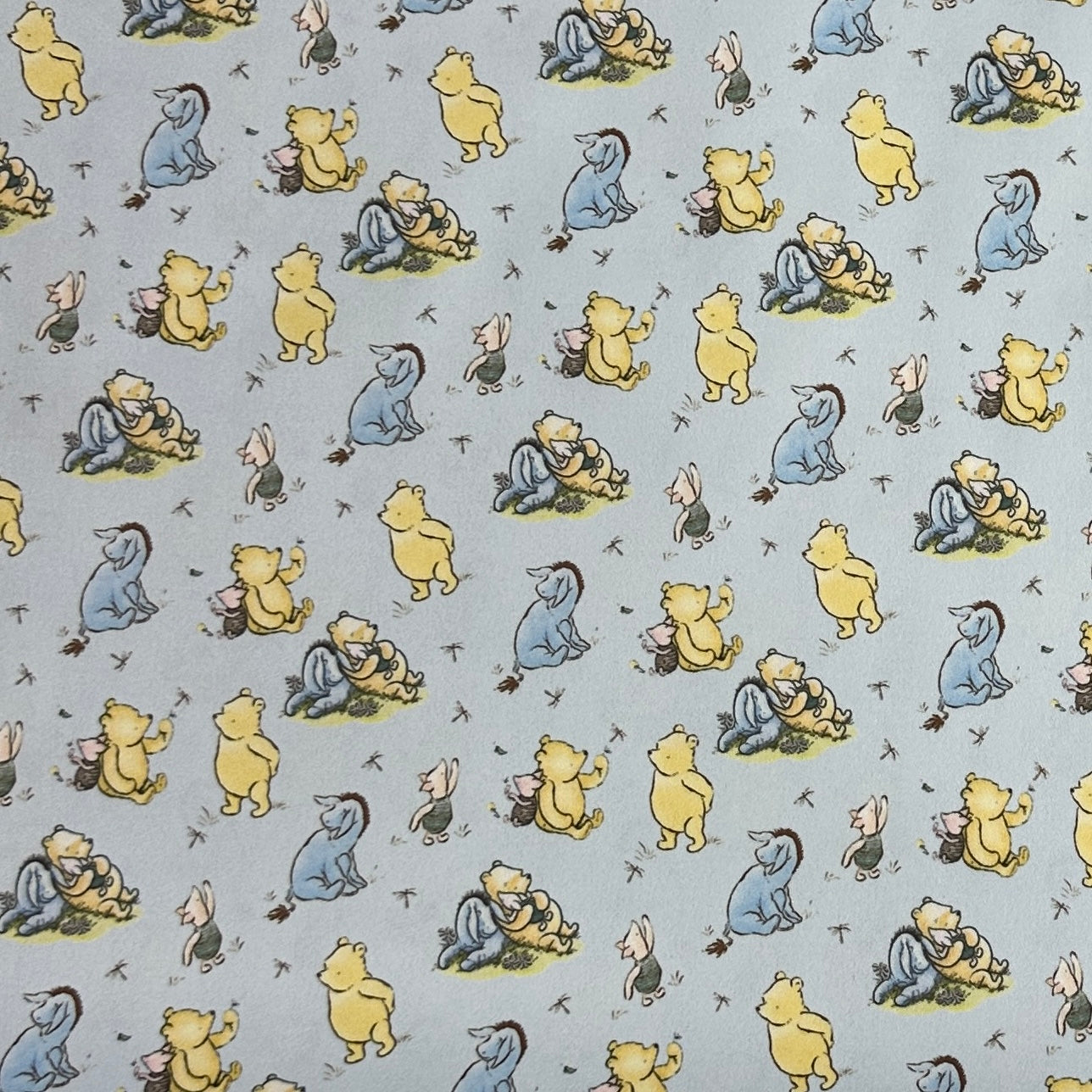 Winnie the Pooh and Friends on Blue 1 mil PUL Fabric - Made in the USA - Nature's Fabrics