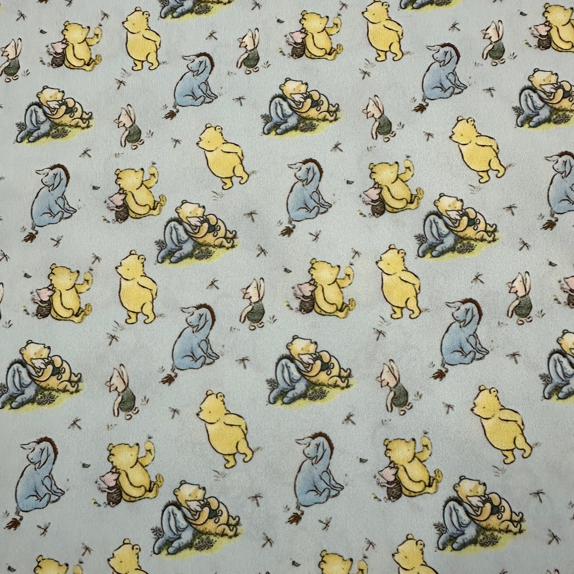 Winnie the Pooh and Friends on Blue 1 mil PUL Fabric - Made in the USA - Nature's Fabrics