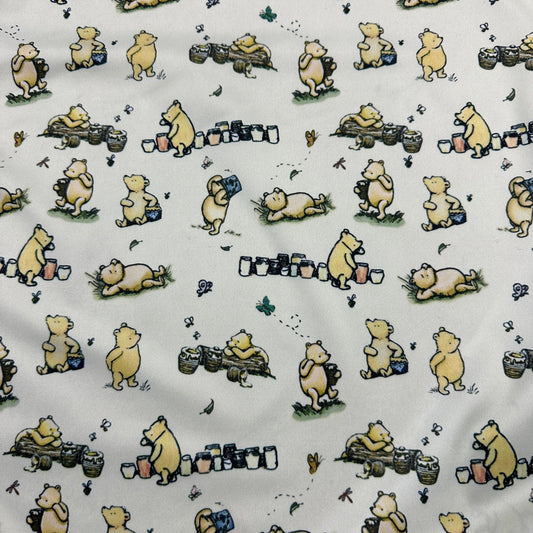 Nature's Fabrics organic cotton cloth featuring a yellow bear and honey pots pattern