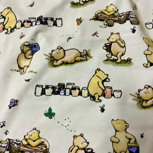 Winnie the Pooh and Honey Pots on Cream Bamboo/Spandex Jersey Fabric - Nature's Fabrics