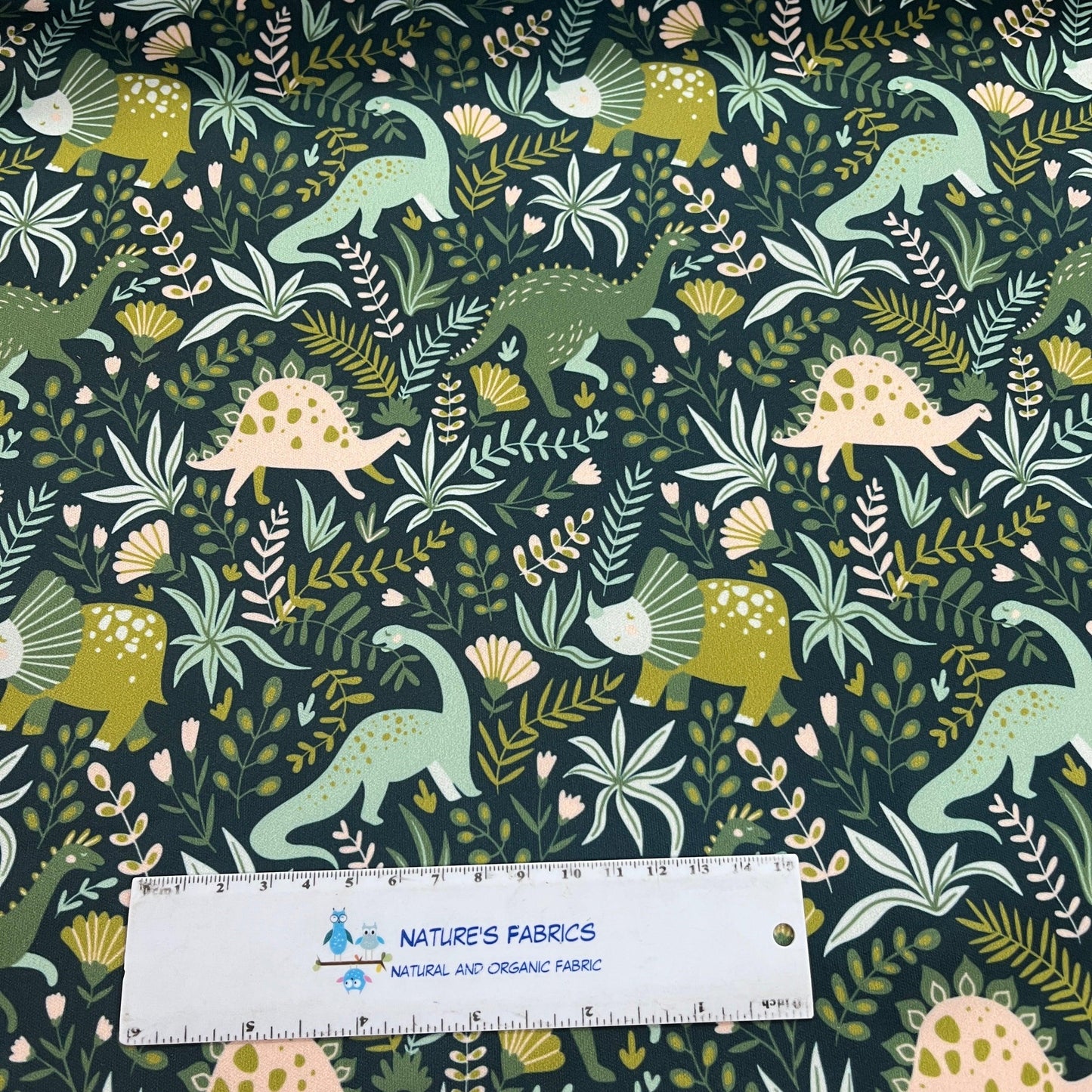 Dinosaurs on Green 1 mil PUL Fabric - Made in the USA - Nature's Fabrics