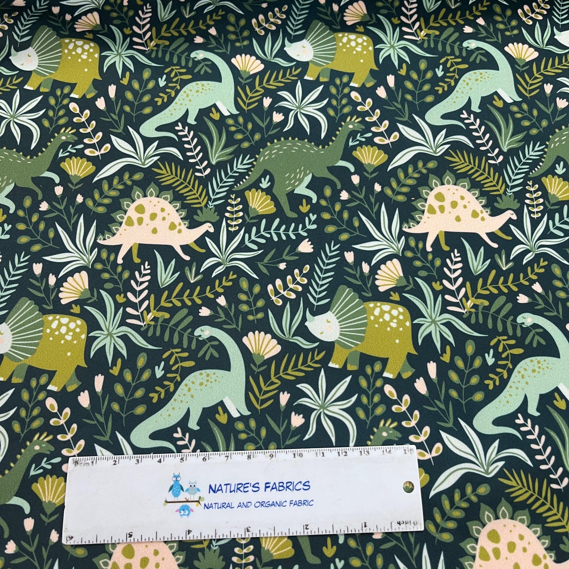 Dinosaurs on Green 1 mil PUL Fabric - Made in the USA - Nature's Fabrics
