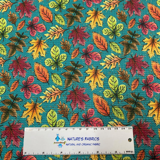 Fall Leaves on Teal Bullet Knit Fabric - Nature's Fabrics