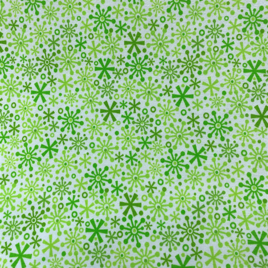 Holidays Flakes Green Cotton/Spandex Jersey Fabric - Nature's Fabrics