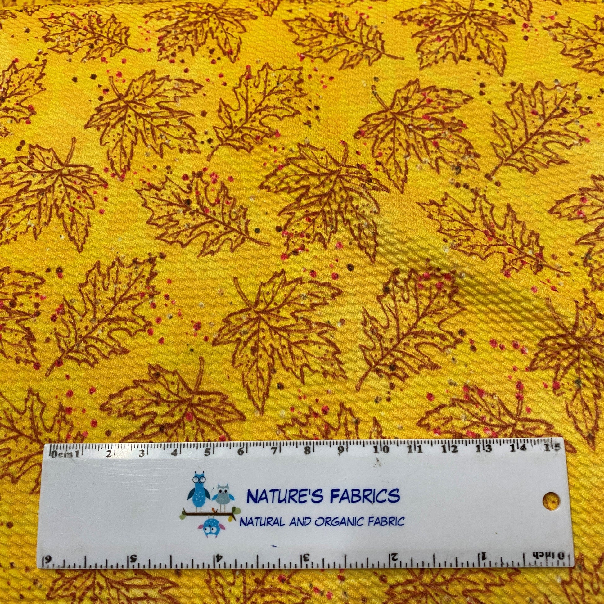 Maple and Oak Leaves on Gold Bullet Knit - Nature's Fabrics