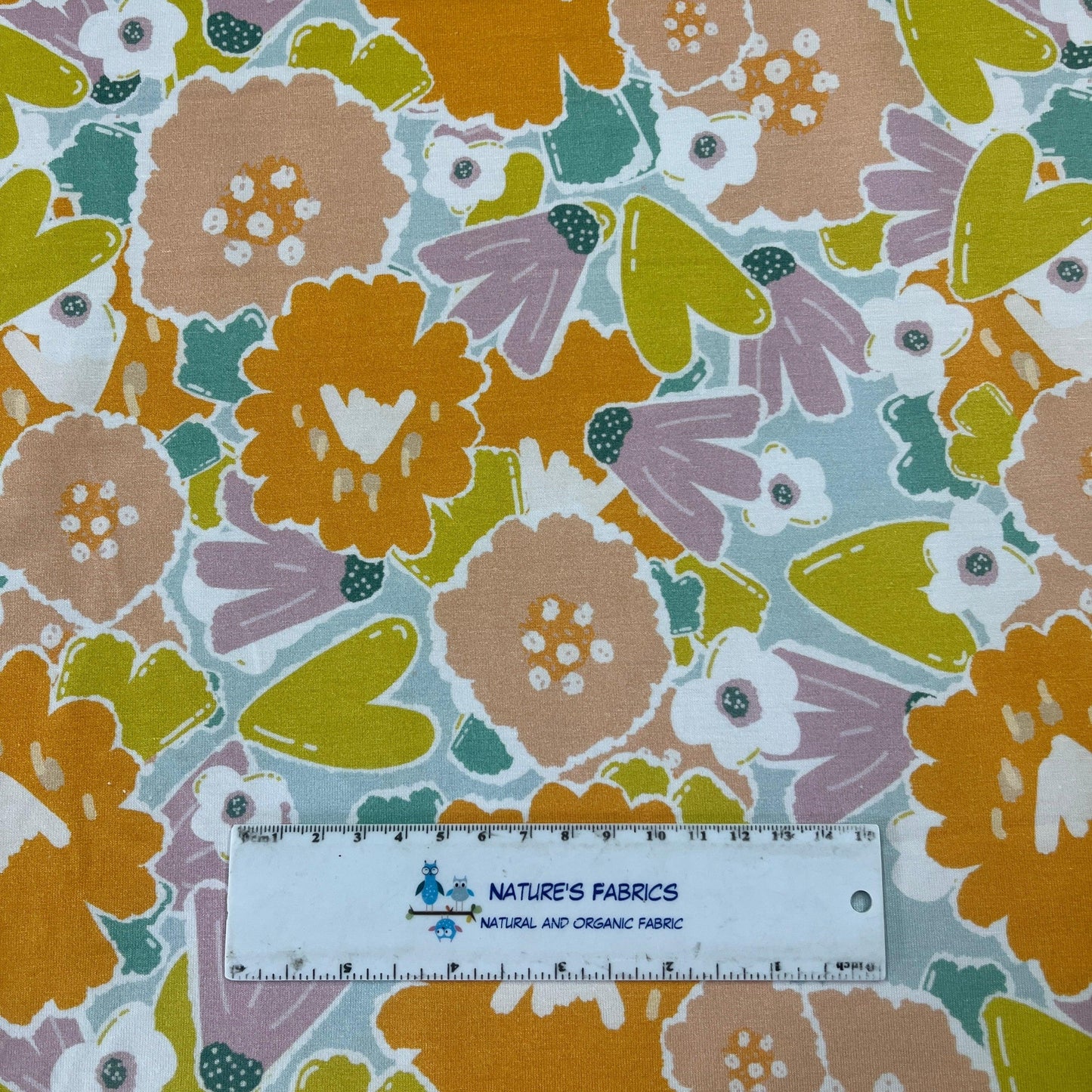 Orange Flowers on Mint Bamboo/Spandex Jersey Fabric - Nature's Fabrics