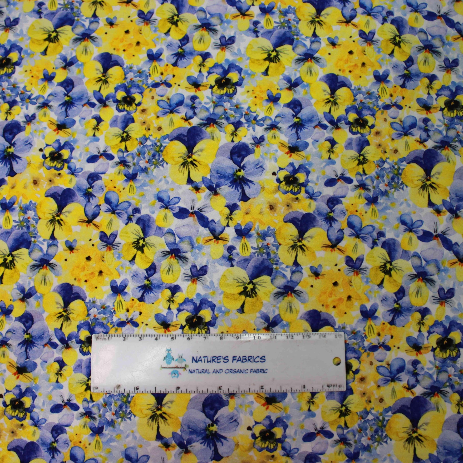 Pansy Toss on Bamboo Stretch French Terry Fabric - Nature's Fabrics