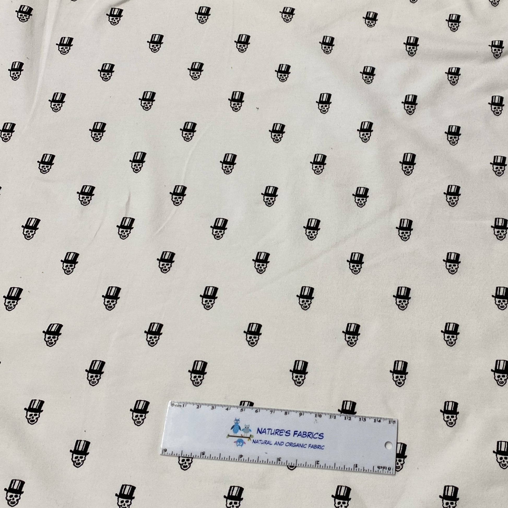 Small Black Skulls on White Cotton/Spandex Jersey - Nature's Fabrics