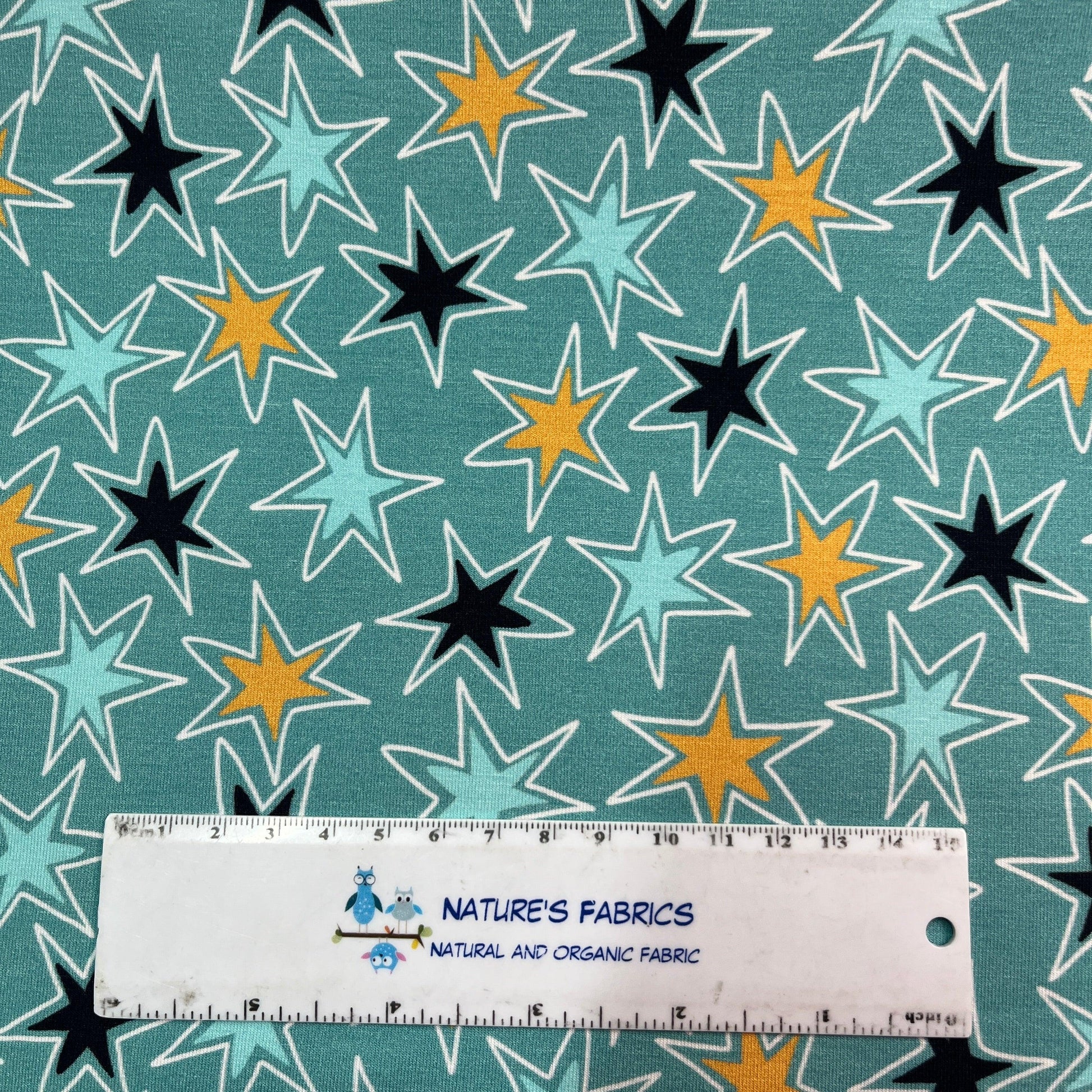 Texas Stars on Blue Bamboo/Spandex Jersey Fabric - Nature's Fabrics