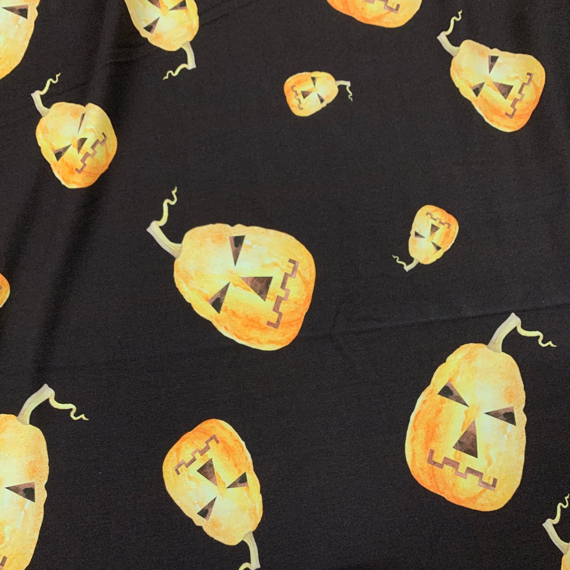 Tossed Pumpkins on Brown Bamboo/Spandex Jersey Fabric - Nature's Fabrics