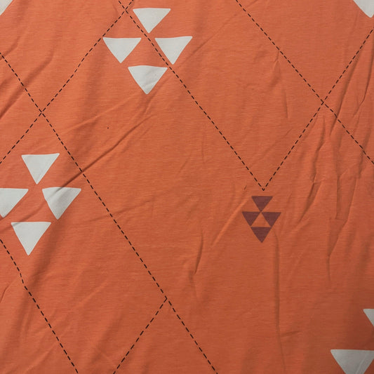 Triangles on Peach Organic Cotton/Spandex Jersey Fabric - Nature's Fabrics