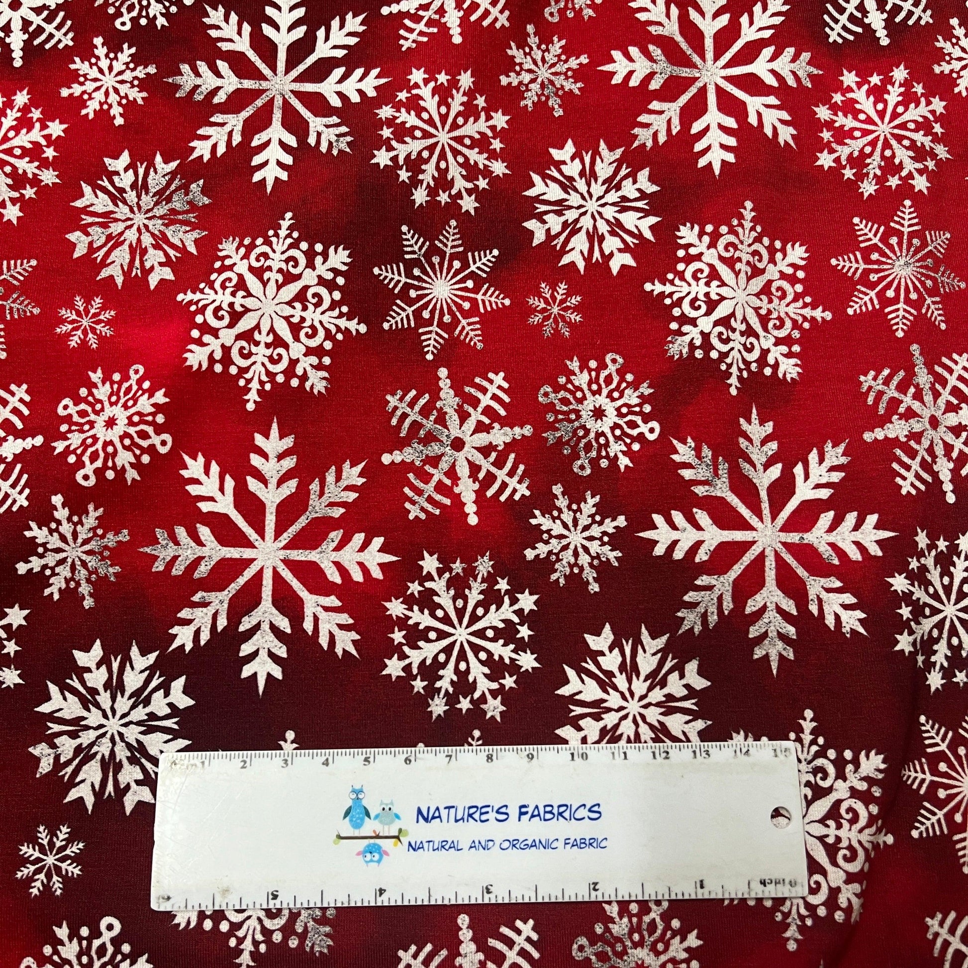 White Snowflakes on Dark Red Bamboo/Spandex Jersey Fabric - Nature's Fabrics