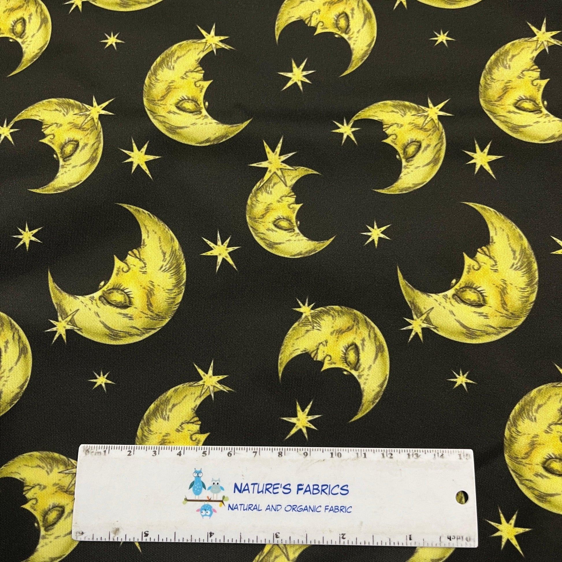 Yellow Moons and Stars on Black 1 mil PUL Fabric - Made in the USA - Nature's Fabrics
