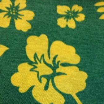 Yellow Tropical Flowers on Green Cotton/Poly Jersey